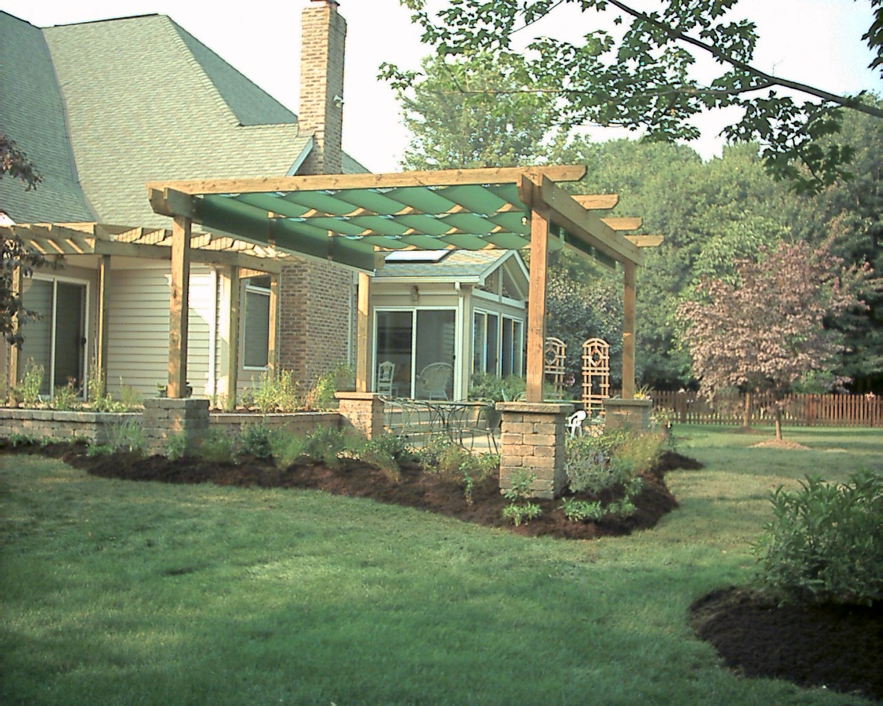 Backyard garden with pergola and patio