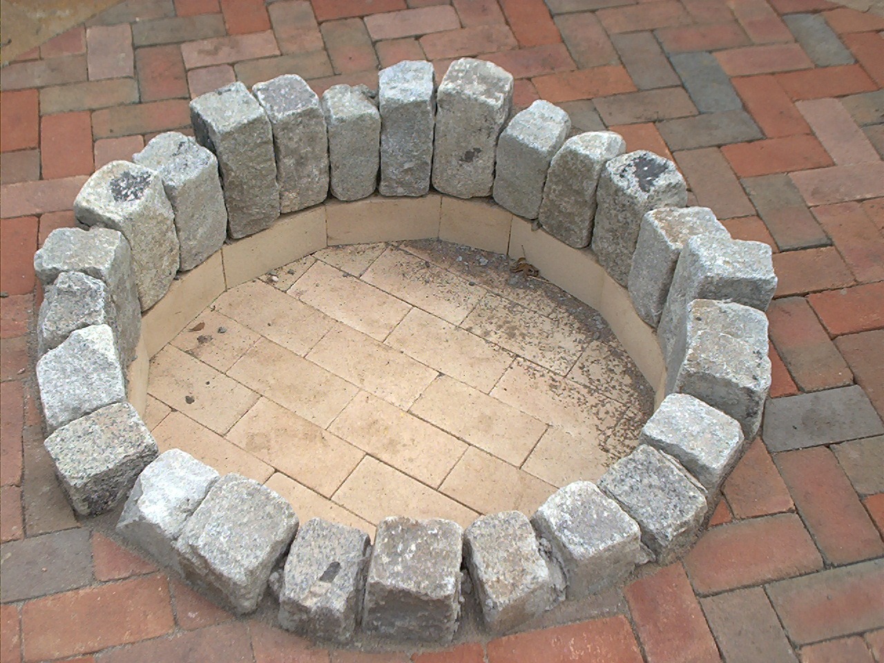 Stone firepit on brick patio