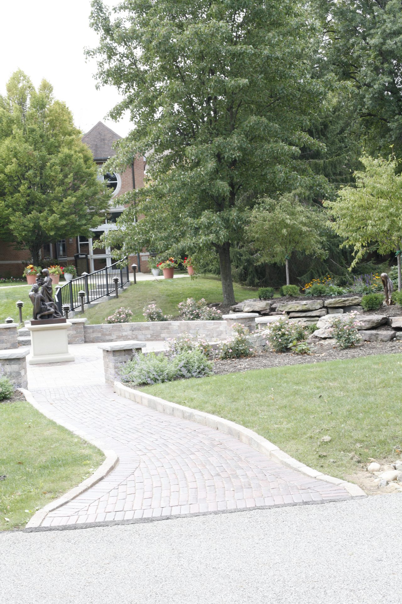 Garden path with statue and trees