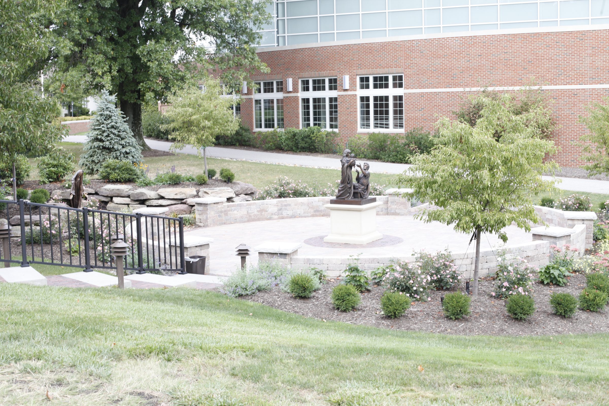 Outdoor garden with statue and pathway