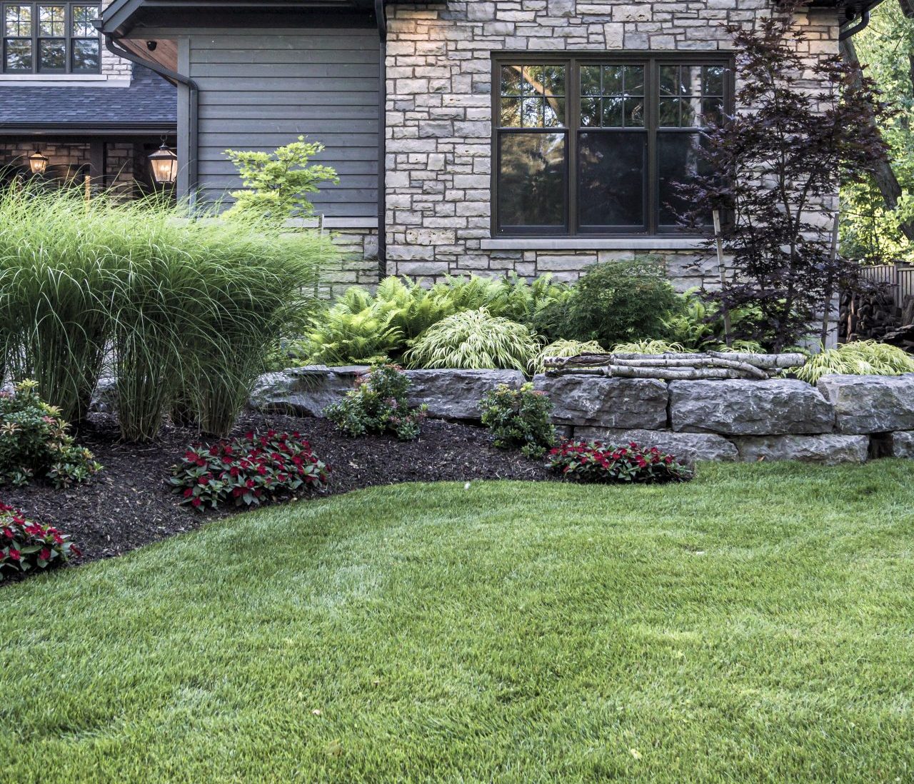 Modern stone house with landscaped garden