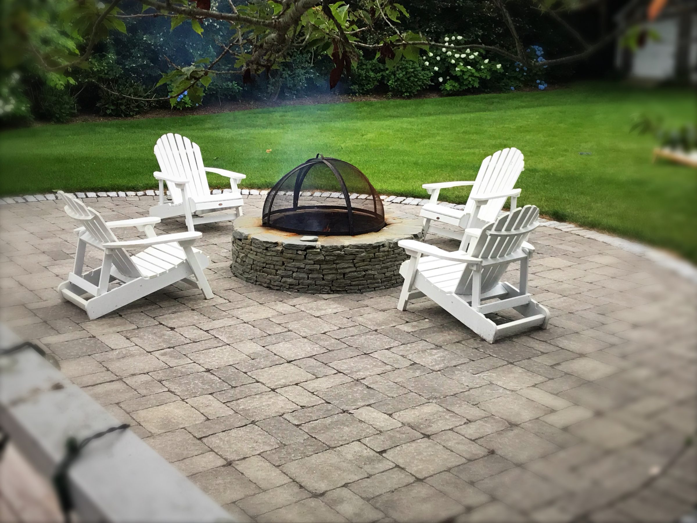 Outdoor patio with fire pit and chairs
