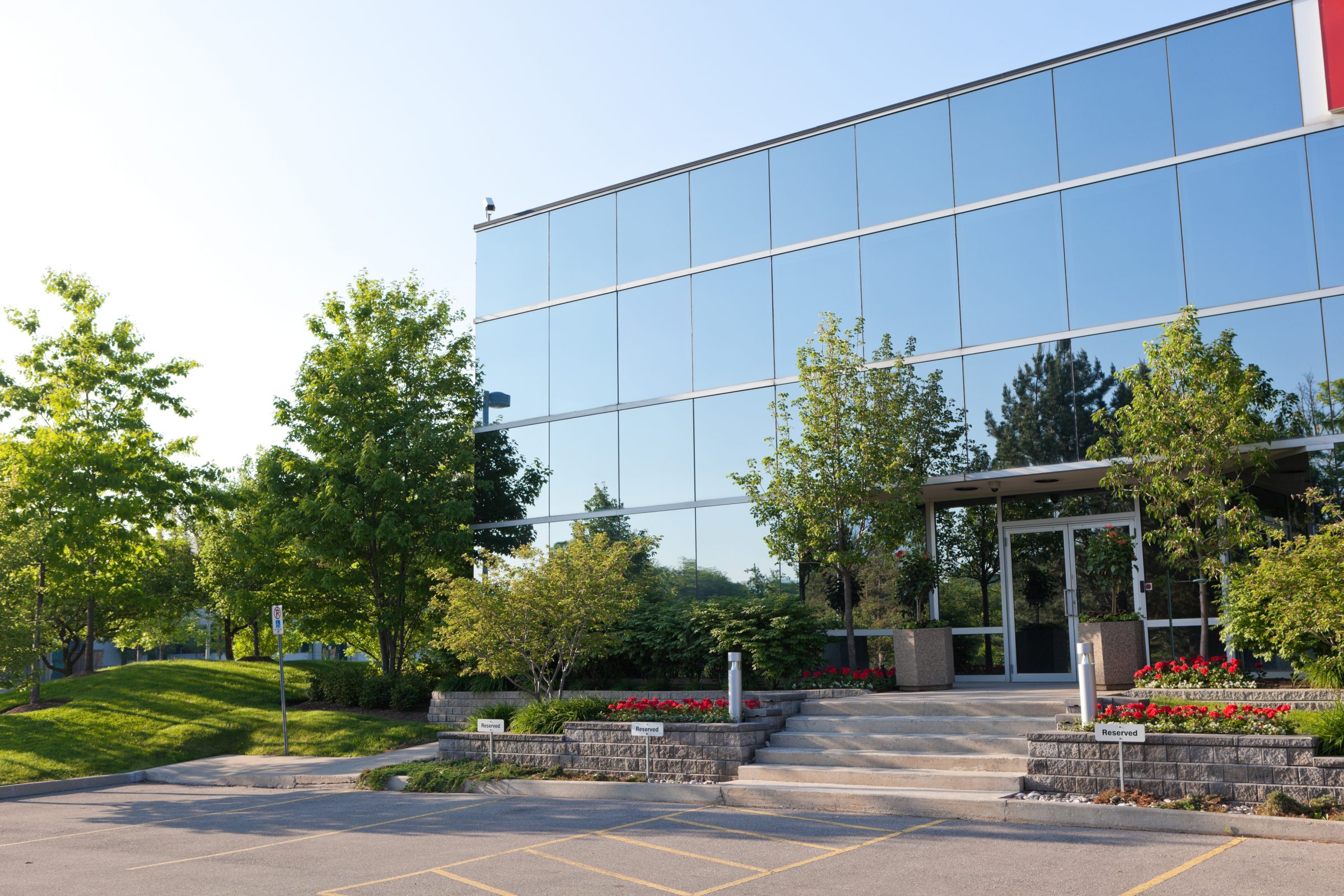 Modern office building with reflective glass windows.
